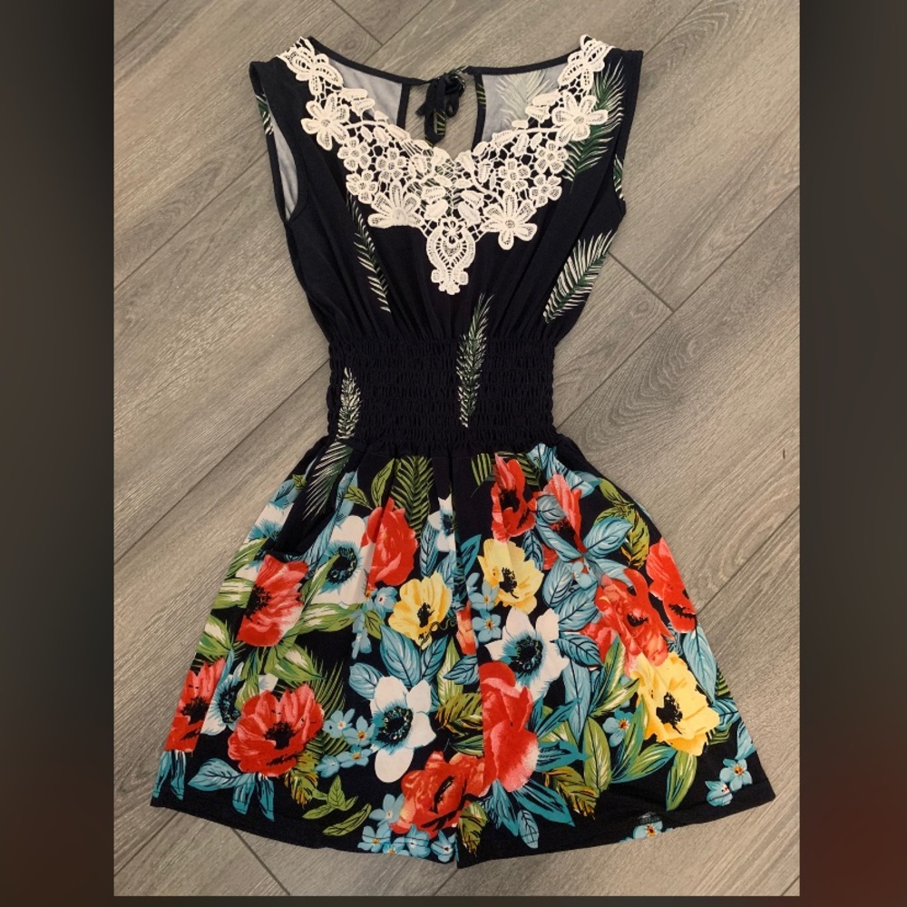 Navy Blue Romper with Tropical Print, White Lace Detailing and a Cinched Waist